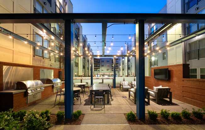 a patio with a table and chairs in a courtyard