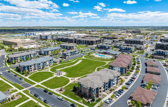 an aerial view of a city with buildings and a green park at Arbour Commons, Colorado, 80023