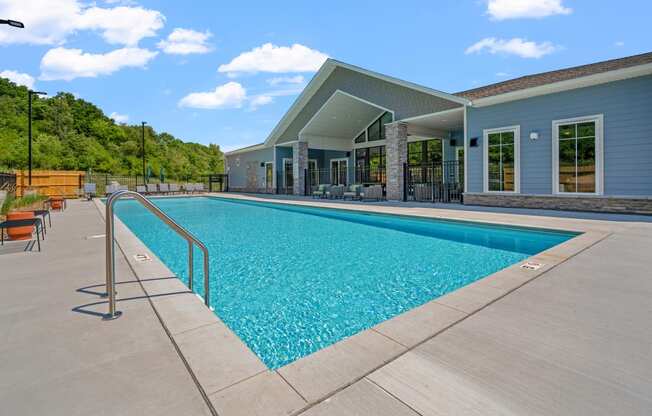 a swimming pool with a building in the background at The Lodge at Overland in Rochester Minnesota