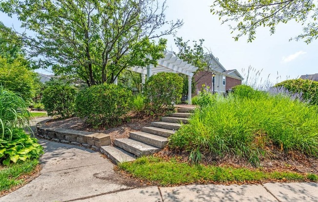 a set of concrete steps leading up to a house