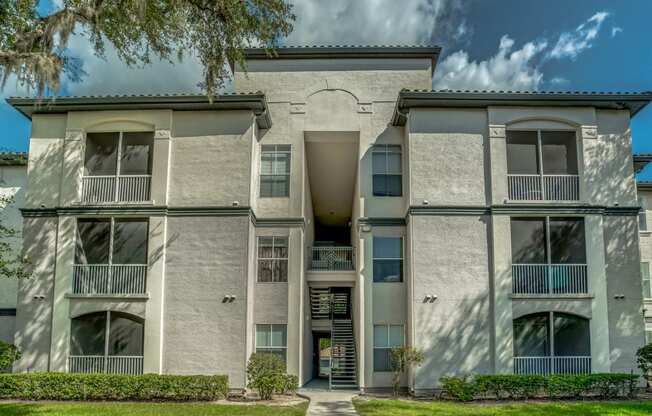 3 story apartment building exterior with breezeways