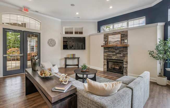 Clubhouse lounge with fireplace - Lantern Woods Apartments