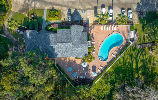 A large house with a pool in the backyard.