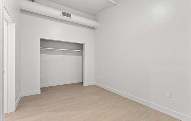 A white room with a sliding door and a white wall. at Brickside Heights, Millcreek, 84106