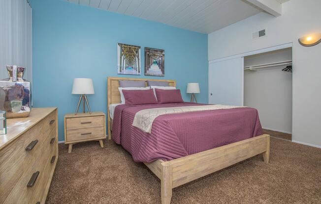 a bedroom with a bed in a room