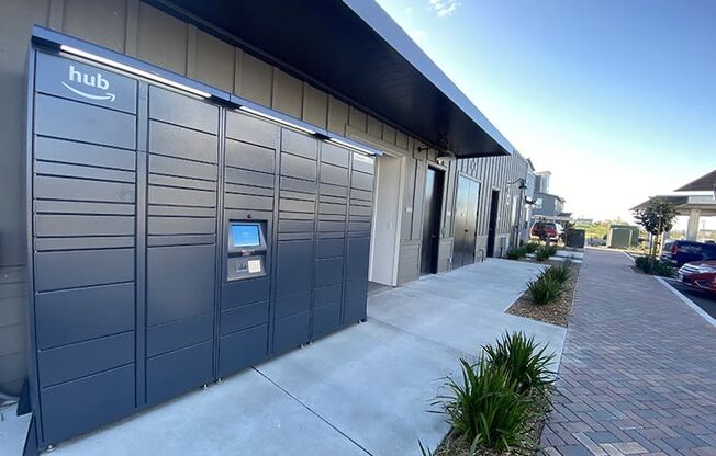 a row of lockers outside a building with a blue sky in the background