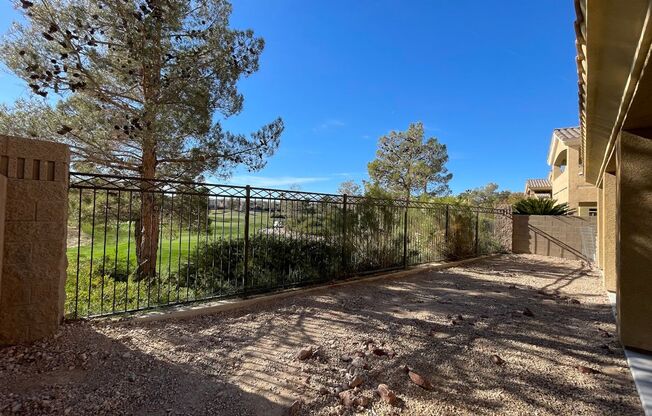 Stunning golf course view! Beautiful home is located on golf course inside Rhodes Ranch guard gated community! Master bedroom is downstairs!