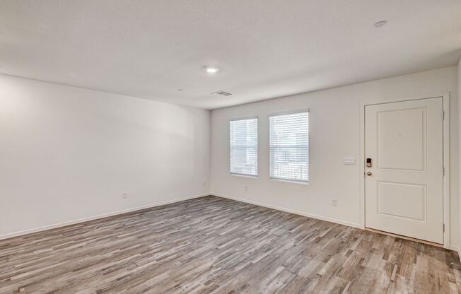 Adorable BRAND NEW three bedroom townhome with a 2 car garage in Tule Springs!