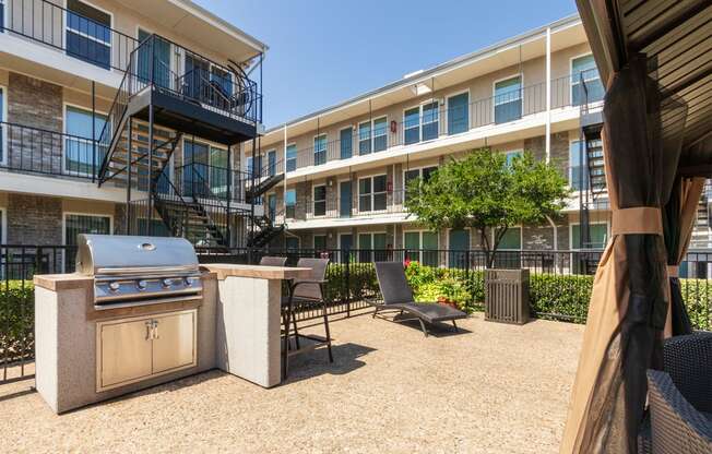 This is a photo of the grilling station in the pool area at The Summit at Midtown Apartments in Dallas, TX.