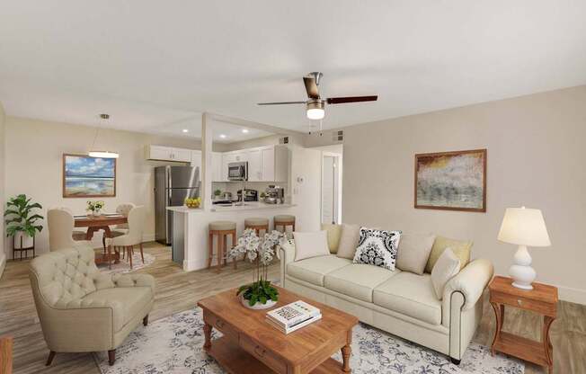A living room with a beige sofa, a wooden coffee table, and a painting on the wall.