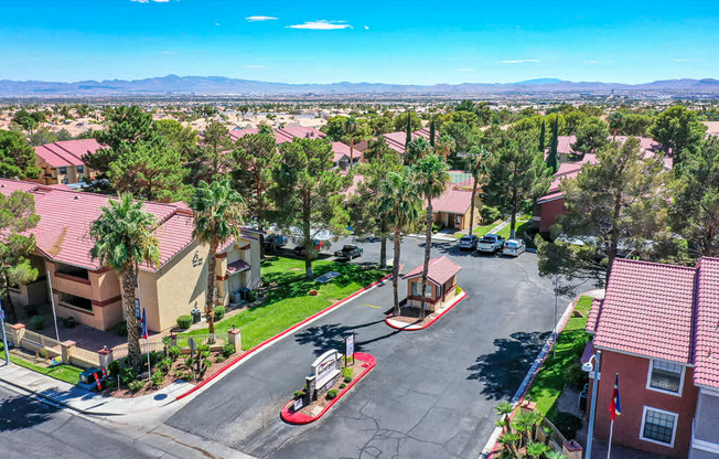 an aerial view of a neighborhood with houses and trees