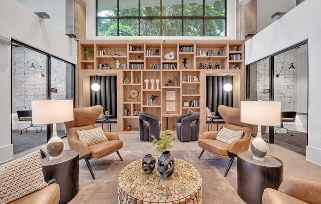 a living room filled with furniture and a book shelf