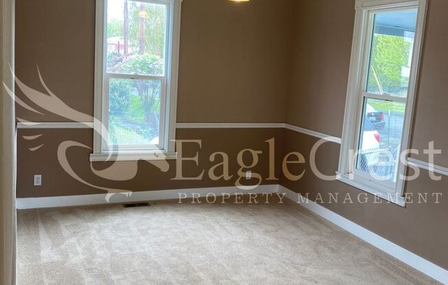 Charming 2 Bedroom Home With 1 Car Garage and A Covered Porch
