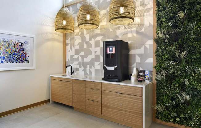 A wall-mounted cabinet with a coffee maker on top.