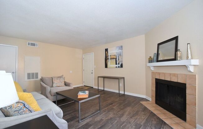 a living room with a fireplace and a couch