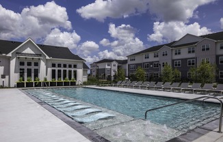 Resort-style pool with spacious sundeck at Beckett West Fork apartment homes in Conroe, TX.