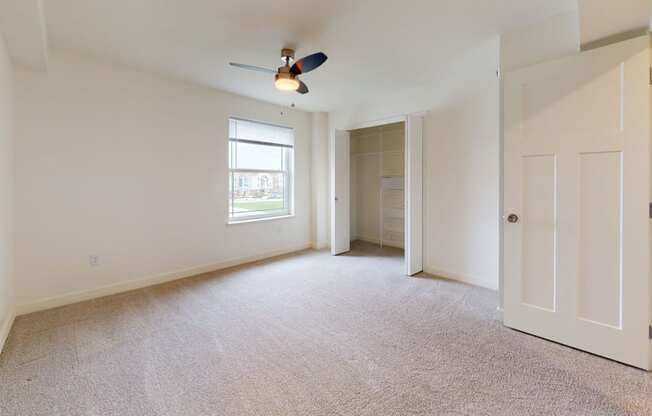 Bedroom with Large Walk-In Closet at The Reserve at Destination Pointe in Grimes, IA with