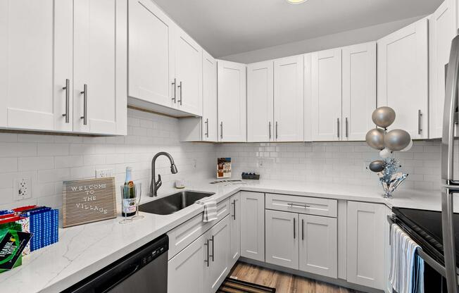 a kitchen with a sink and a refrigerator
