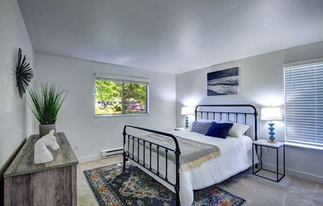 Apartments for Rent in Kirkland WA - Woodlake - Bedroom with Beige Carpeting, White Walls, and Small Window
