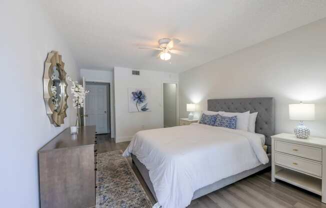Apartments In Coconut Creek for Rent – Waterview at Coconut Creek – bedroom with ceiling fan, hardwood floors, a bed and a dresser