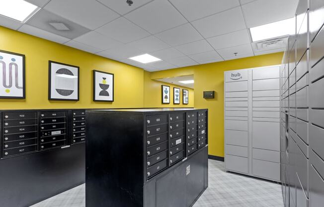 a view of a locker room with lockers and a yellow wall