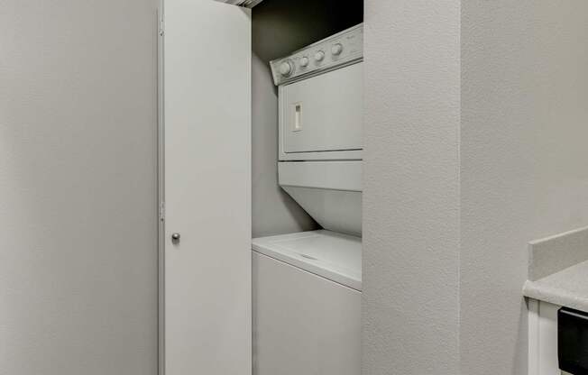 Model Laundry Room with Washer & Dryer at Landings at Morrison Apartments located in Gresham, OR.