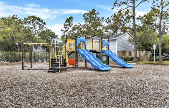 a playground with slides at a park