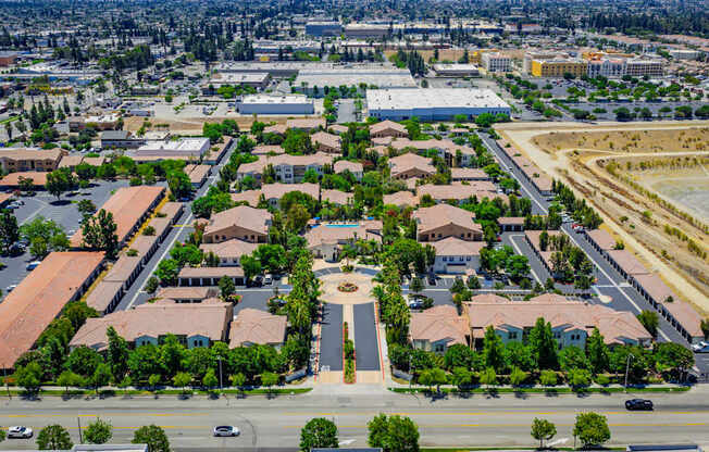 A bird's eye view of a residential area with a central square.