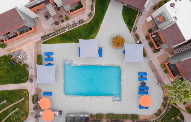 arial view of a swimming pool in a house with umbrellas