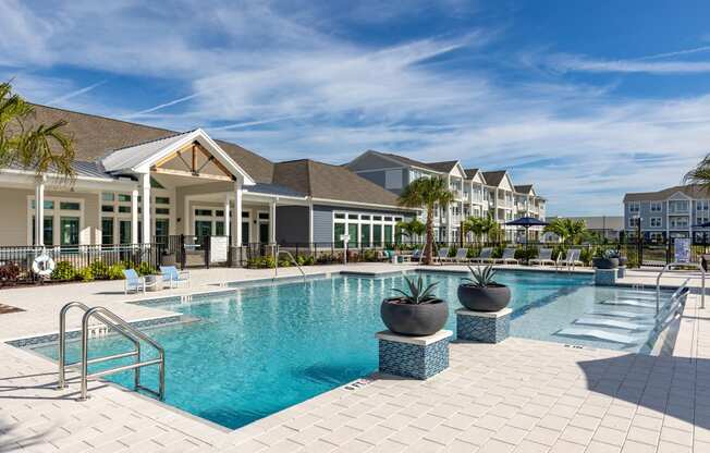 a swimming pool with a building in the background