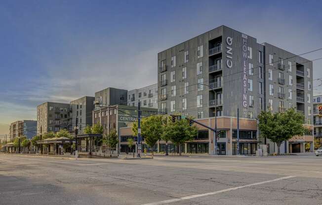 an empty street in front of an apartment building