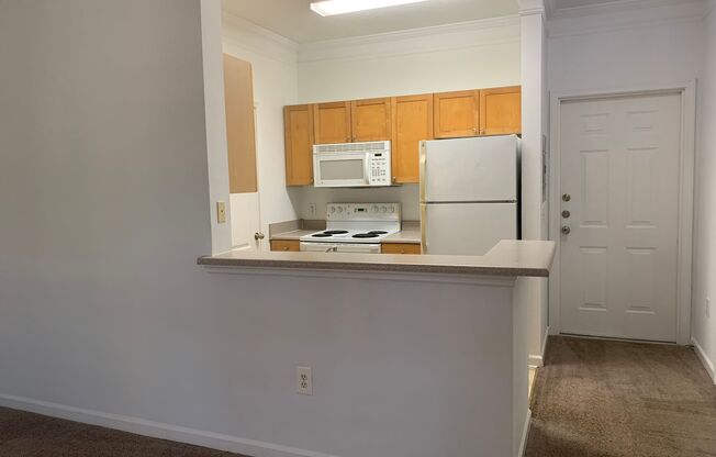 1/1 Ground Floor Unit with attached Garage!  Mirabella Condominiums