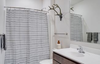 Spacious bathroom with tub/shower combo and vanity top