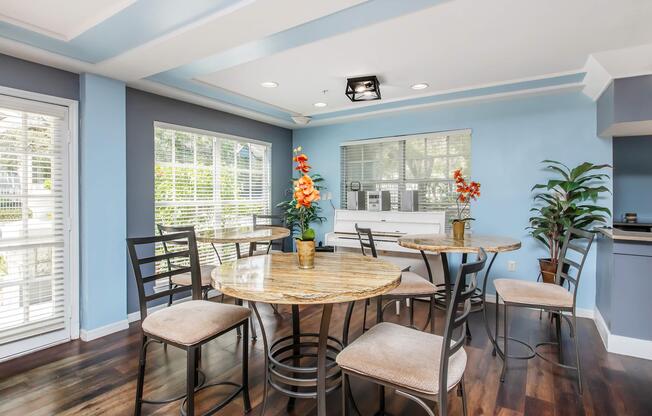 a dining room table in front of a window