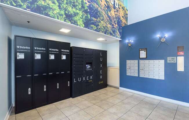 a wall of lockers with a large mural on top of it