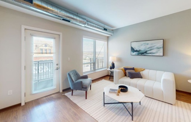 a living room with a white couch and a table