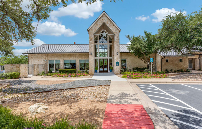 A building with a red pathway leading to the entrance.
