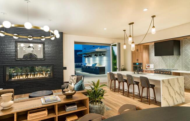 Host with ease in Modera Shoreline’s entertainment kitchen, where elegant finishes and seamless indoor-outdoor flow set the stage for memorable evenings.