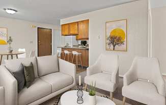 a living room with couches and chairs and a table