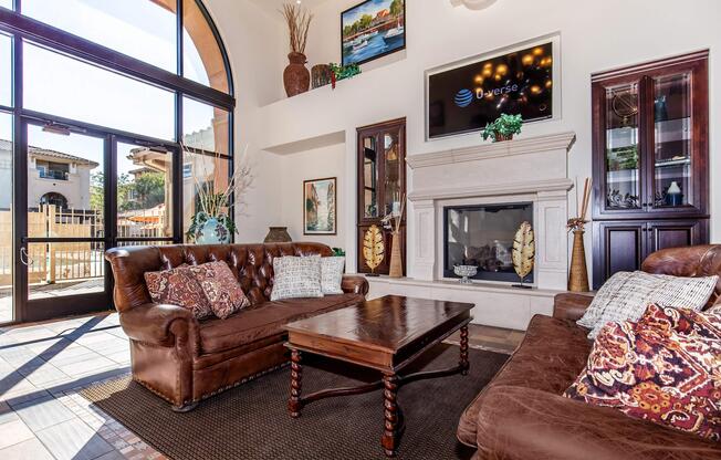 a living room filled with furniture and a fire place