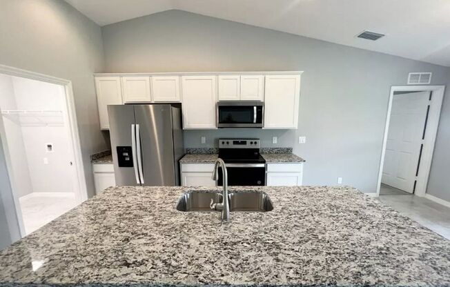 FREE APPLICATION SPECIAL- 3 Bedroom + Den - 2 Bathroom- NE Cape Coral