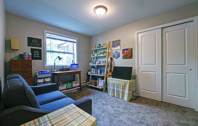 a living room with a couch and a tv