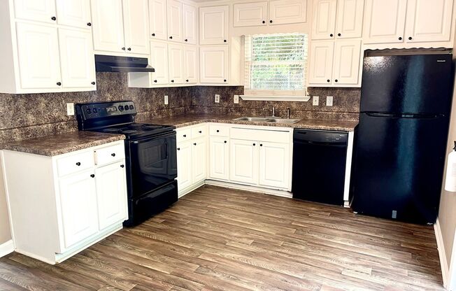 Welcome to this stylish and contemporary 2-bedroom, 1.5-bathroom corner townhome in Stockbridge!