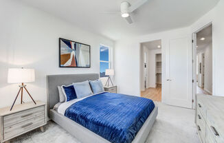 a bedroom with a bed and a closet