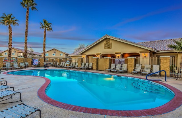 North Las Vegas Apartments - Portola Del Sol - Expansive Pool with Surrounding Lounge Chairs