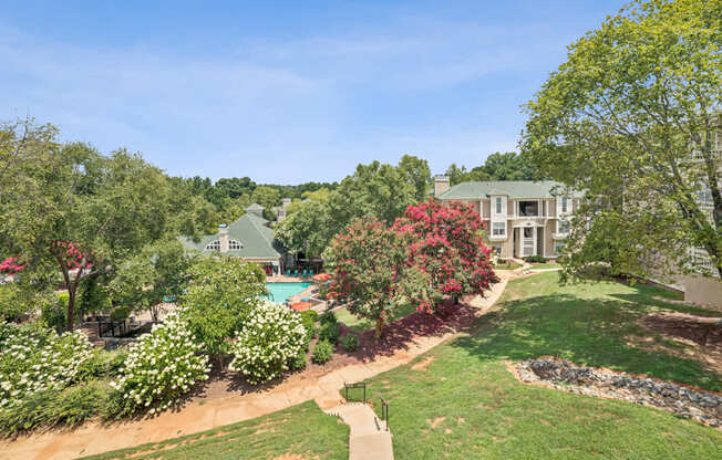 A large house with a pool in the backyard at Beacon Ridge Apartments, PRG Real Estate Management, Greenville, 29615