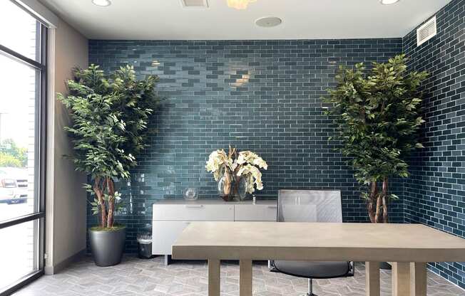 A conference room with a long table and chairs.