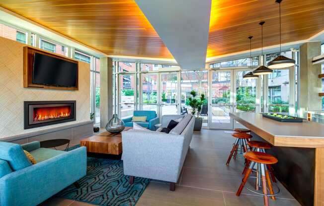 Club Room With Large Screen Tvs And A Fireplace at Equinox, Washington