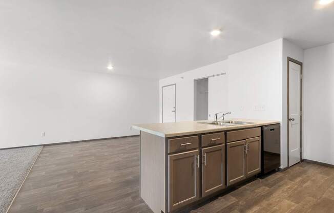 A kitchen with brown cabinets and a white countertop.