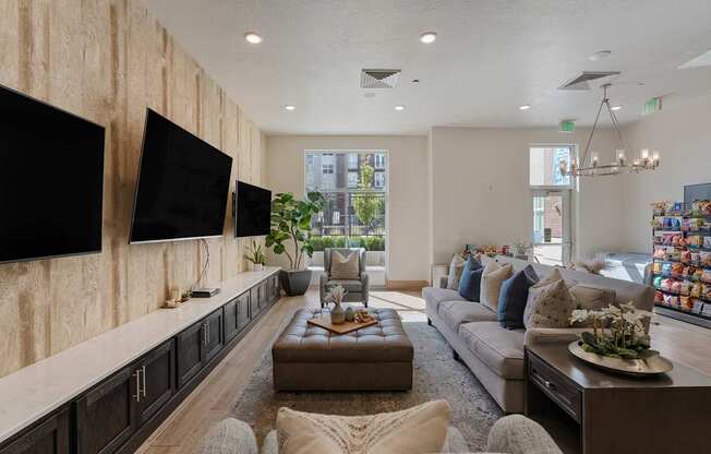 a living room with a large couch and a tv